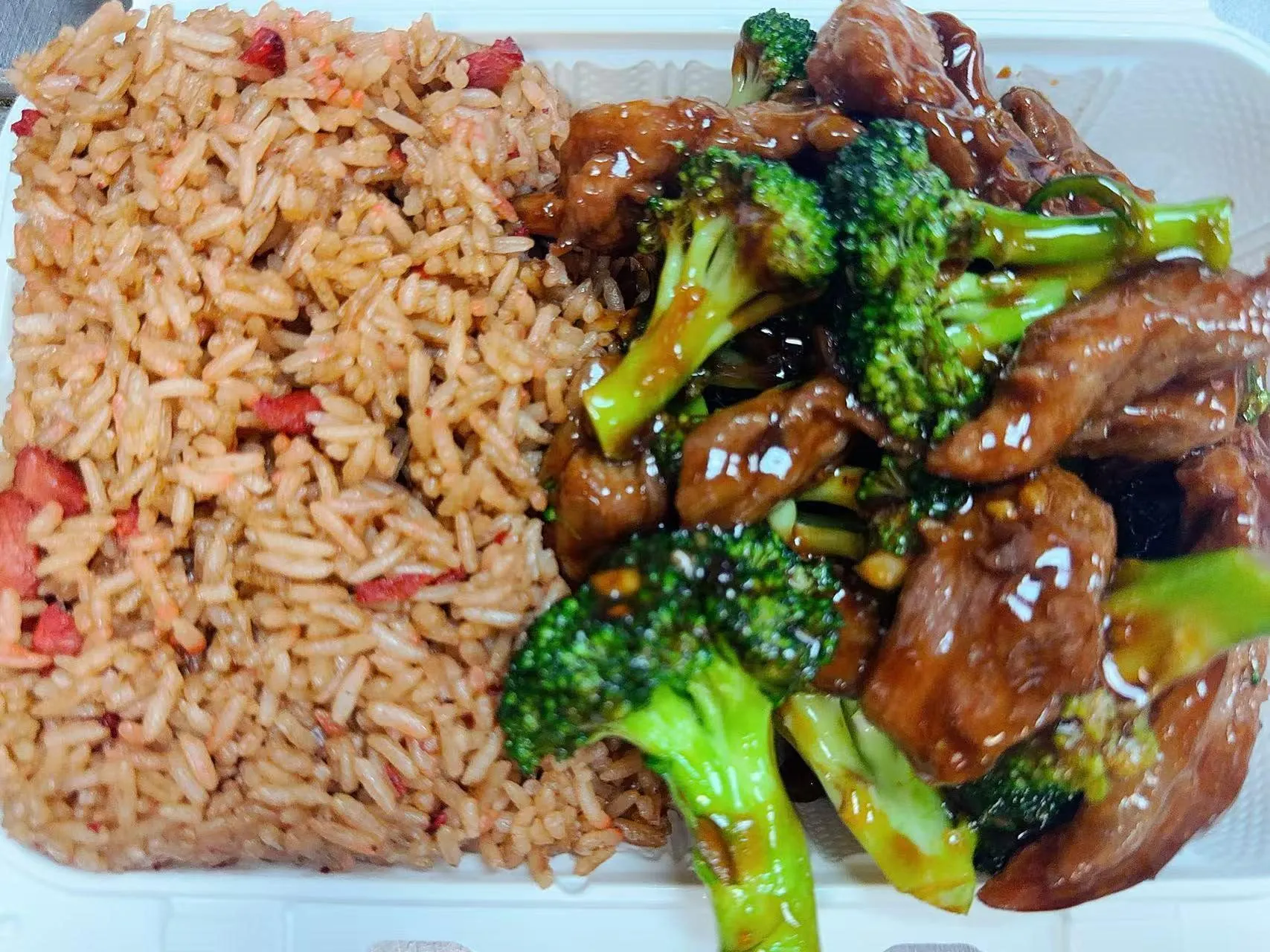 Beef broccoli combo plate with side pork fried rice in takeout container at Silk Road Bistro, a Chinese Restaurant in Martiborough